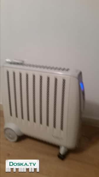 Конвекторный обогреватель, энергосберегающий, бесшумный, имеет пульт управления, регулятор температуры и