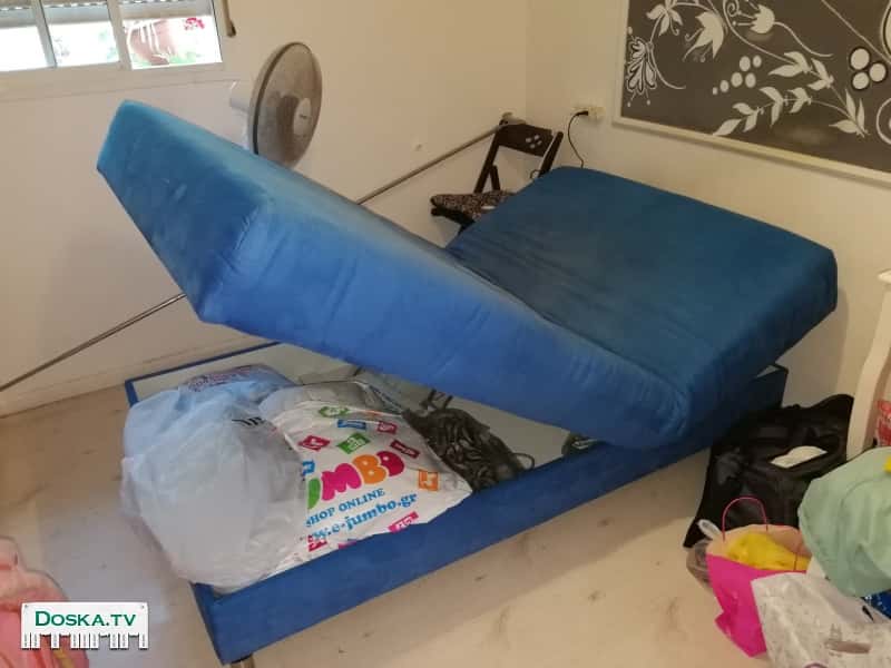 Кровать с електро механизмом и отделом для белья. В нормальном