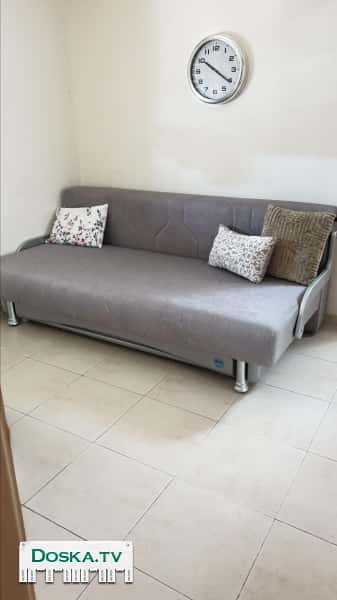 Диван раскладной серого цвета, куплений три года назад,но не